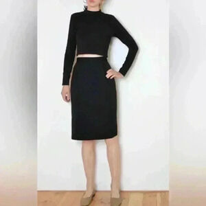 Vintage pure wool black staple Koret midi skirt. Made in the USA